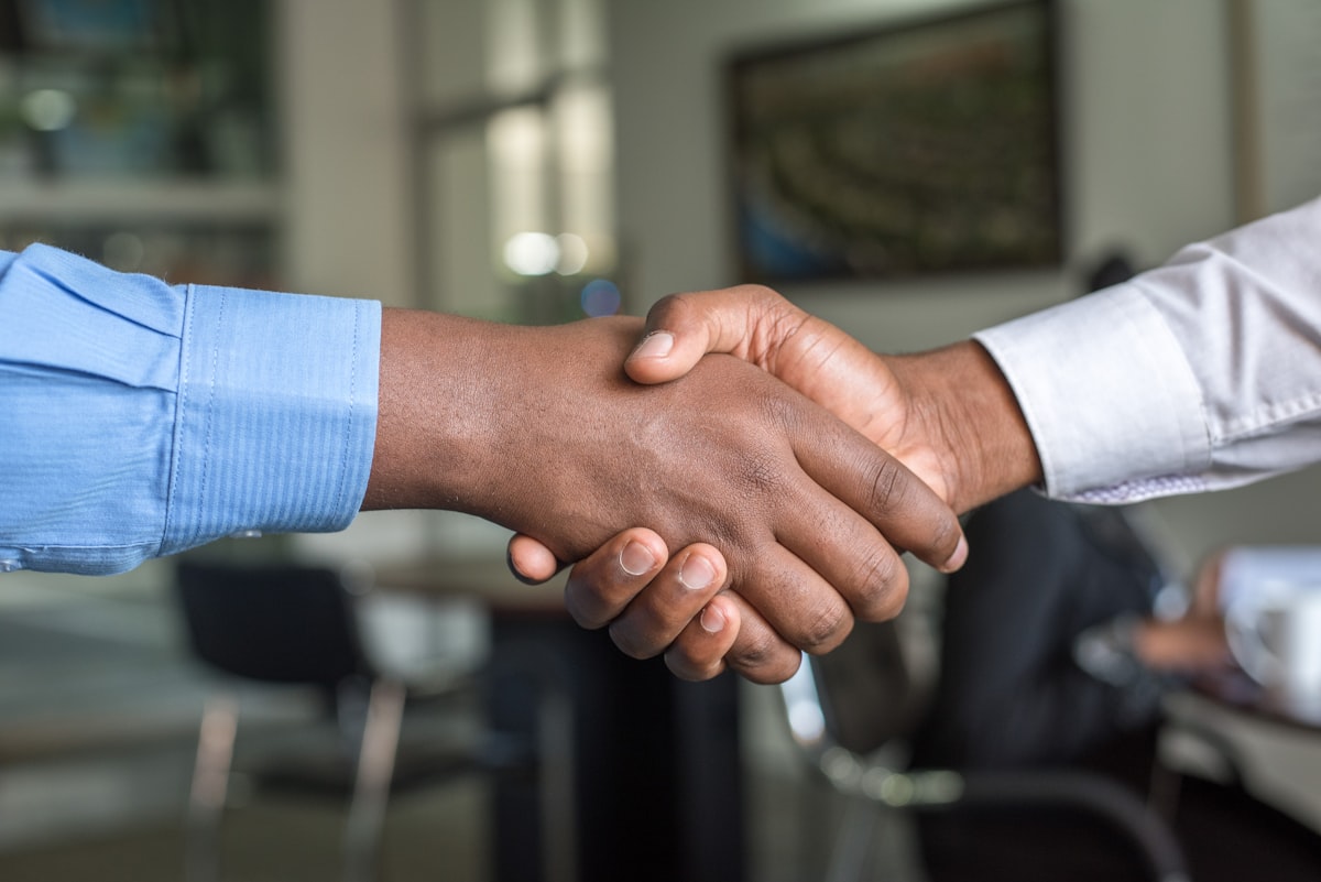 Business partners shaking hands after a successful meeting